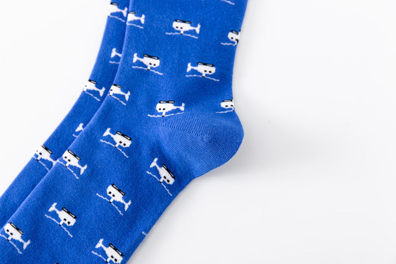 Closeup image of blue helictoper socks with reinforced heels laid flat