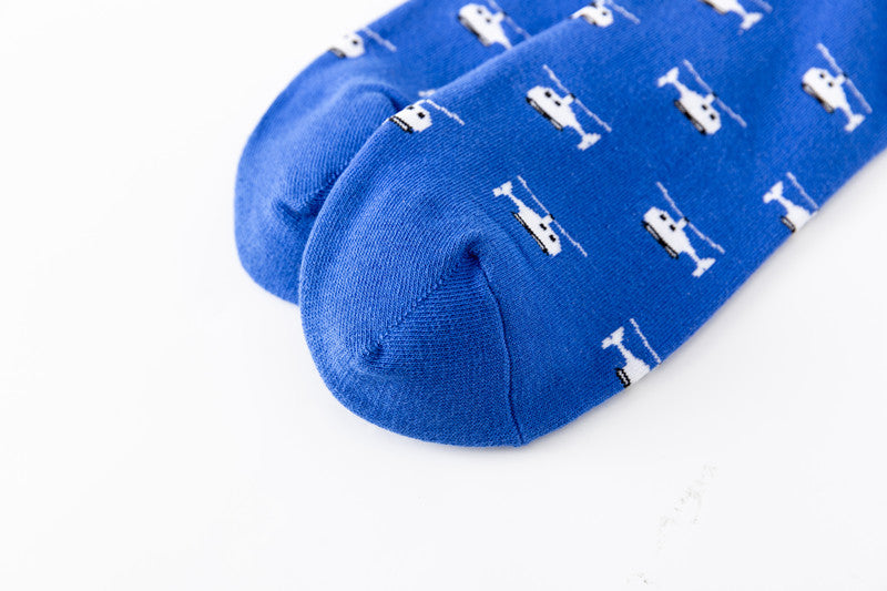 Close up image of the toe seam of blue helpicopter socks laid flat
