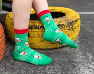 Green soccer player socks for kids worn by model