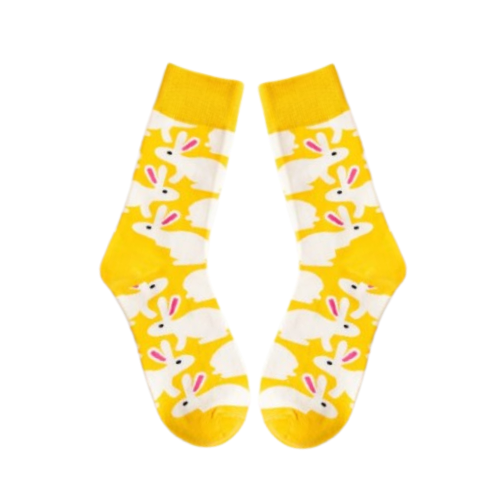 A pair of yellow socks with a pattern of bunny rabbits.