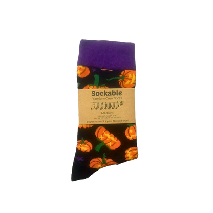 Halloween-themed sock with pumpkins on a white background with Sockable Label