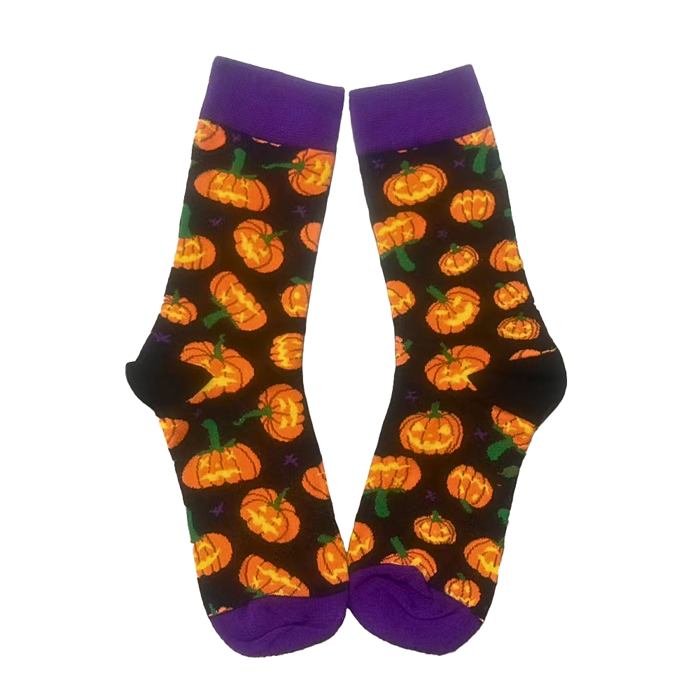 Halloween-themed socks with pumpkins on a black background