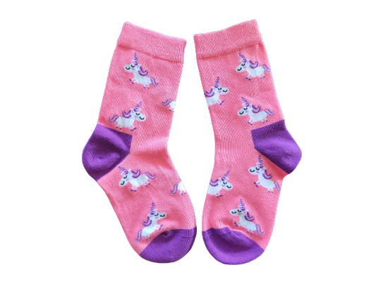 Pink socks with a unicorn pattern and purple heel and toe laid flat.