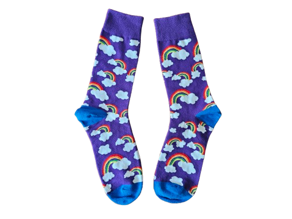 Pair of socks with rainbow and cloud pattern on a purple background