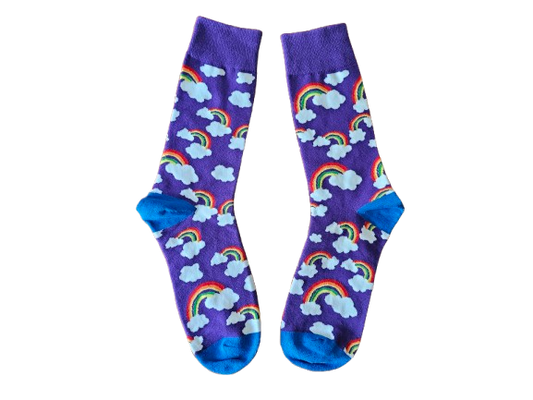 Pair of socks with rainbow and cloud pattern on a purple background