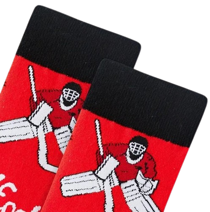 Close up of black cuff on red hockey socks laid flat