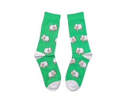 Green sheep socks laid flat on a white background