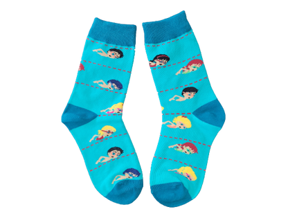 Blue kids socks with kids swimming laid flat